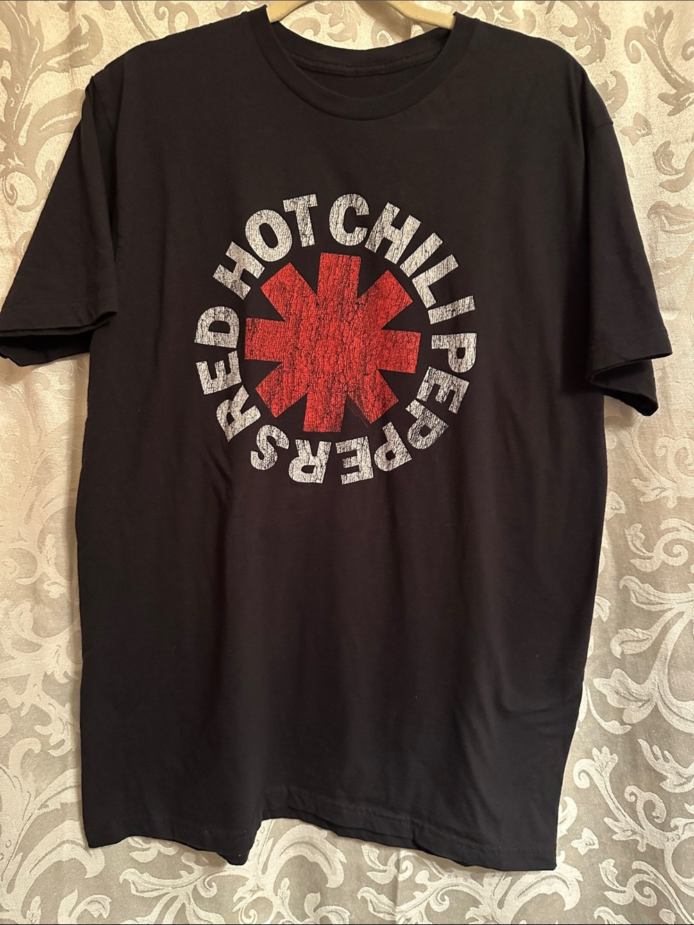 Bravado Black Tee with Distressed Red Asterisk Logo